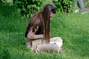Girl reading on the grass